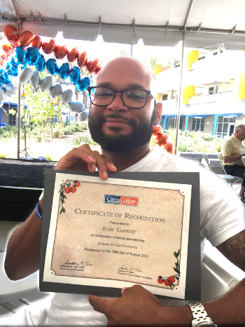 Ivan holding his certificate