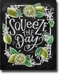 Blackboard with lemons and blossoms saying Squeeze the Day!